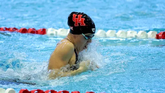 Junior Evelyn Entrekin swimming the breaststroke