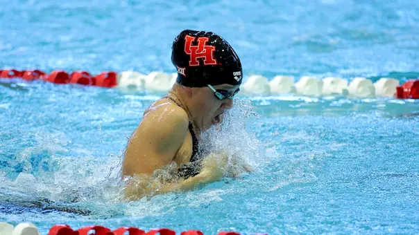 Junior Evelyn Entrekin swimming the breaststroke