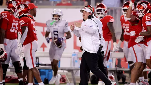 Austin Armstrong coaching on sideline