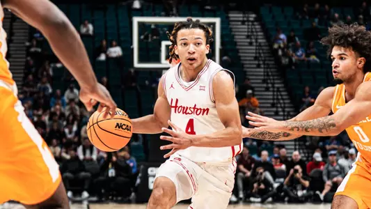 Kingston Flemings dribbles basketball vs Tennessee