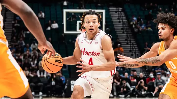 Kingston Flemings dribbles basketball vs Tennessee