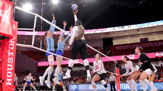 Tara Greenberry attacks a ball against Kansas.