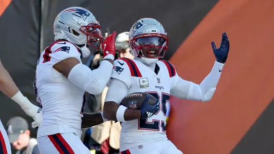 Nov 23, 2025; Cincinnati, Ohio, USA; New England Patriots cornerback Marcus Jones (25) celebrates with teammates after scoring a touchdown during the first half against the Cincinnati Bengals at Paycor Stadium. Mandatory Credit: Joseph Maiorana-Imagn Images