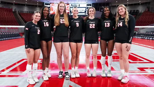 Houston Volleyball Senior Class - Alana Torres-Rivera, Bre Reid, Kellen Morin, Avery Shimaitis, Lottie Scully, Barakat Rahmon and Ella Wendel all stand together for a class picture.
