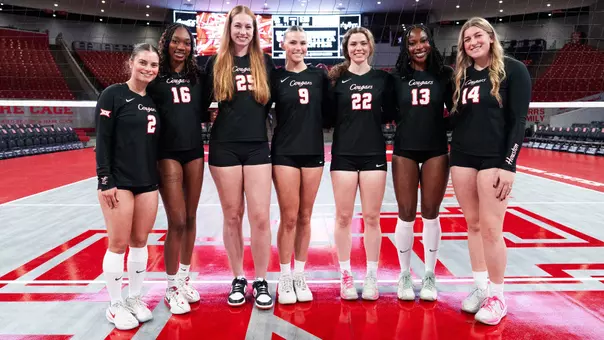 Houston Volleyball Senior Class - Alana Torres-Rivera, Bre Reid, Kellen Morin, Avery Shimaitis, Lottie Scully, Barakat Rahmon and Ella Wendel all stand together for a class picture.