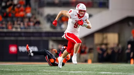 Tanner Koziol moves past Oregon State defenders after catching a pass.