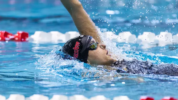Junior Elizabeth Jimenez swimming the backstroke