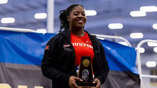 KeAyla Dove holding third place trophy