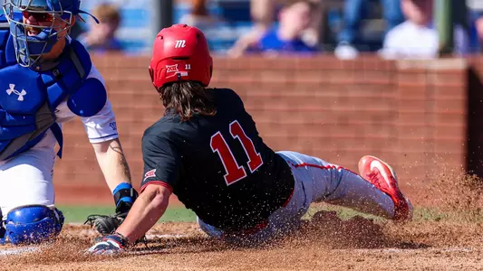 Tyler Cox slides in safely at home at UT Arlington