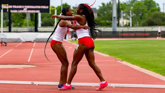 Women's 4x100-meter relay celebrating