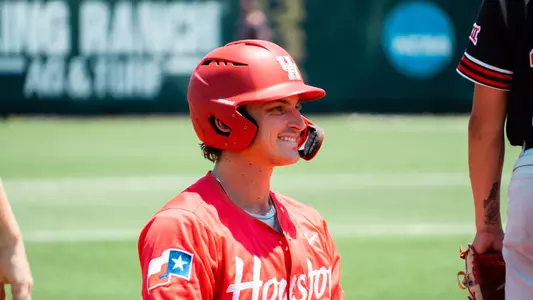 Tyler Cox smiles triple