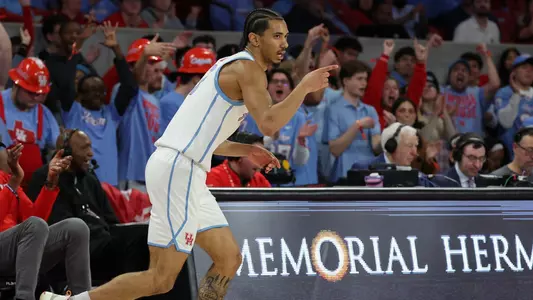 Milos Uzan celebrates vs WVU