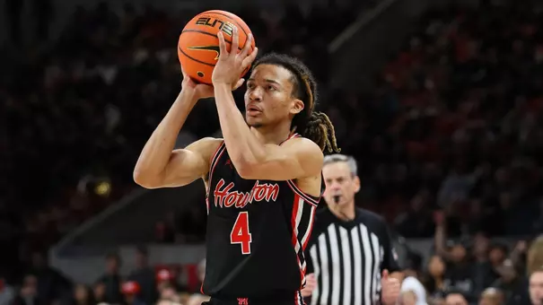 Kingston Flemings shoots a basketball