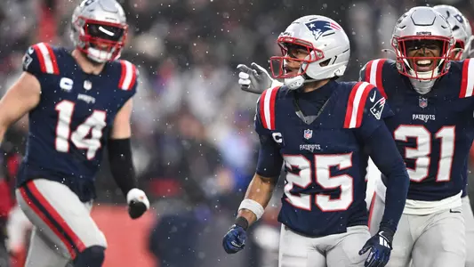 Jan 18, 2026; Foxborough, MA, USA; New England Patriots cornerback Marcus Jones (25) reacts after scoring a touchdown in the second quarter against the Houston Texans in an AFC Divisional Round game at Gillette Stadium. Mandatory Credit: Brian Fluharty-Imagn Images