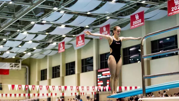 Junior Michelle McLeod diving off the 1-meter springboard at the Big 12 East Showdown