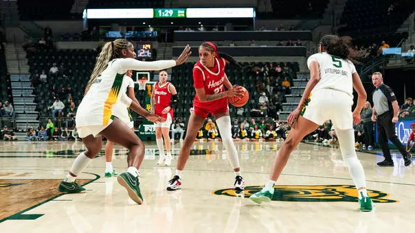 Amirah Abdur-Rahim with ball in hand and two Baylor players on both sides