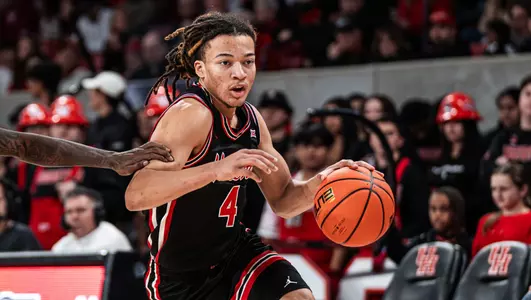 Kingston Flemings driving the basketball