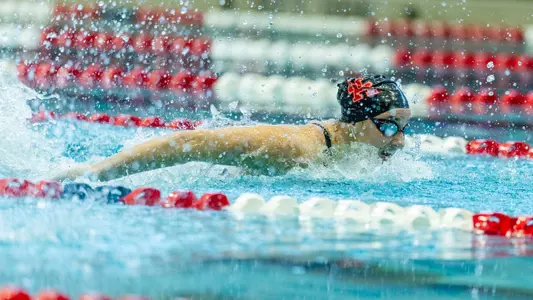 Junior Tierney Howell swimming the butterfly
