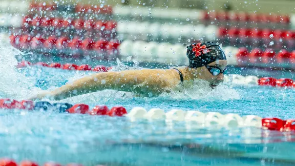 Junior Tierney Howell swimming the butterfly