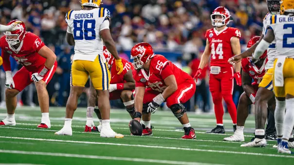 McKenzie Agnello plays center and prepares to snap the ball against LSU in the Texas Bowl
