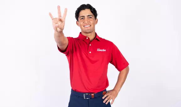 Sebastian Gamboa holds up the Coog sign
