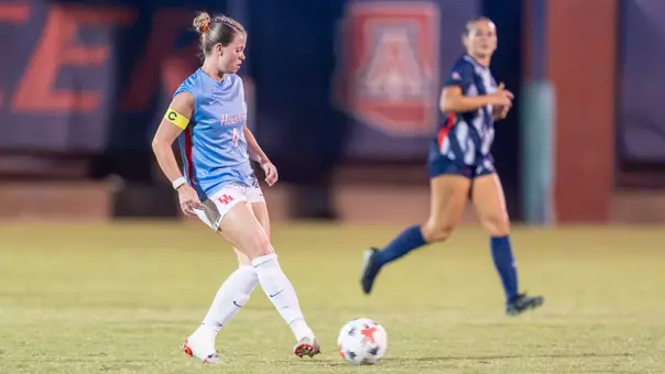 Morgan Donohue kicks a soccer ball