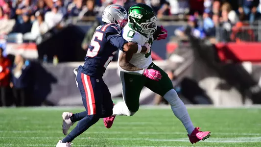 Oct 18, 2026; Foxborough, Massachusetts, USA; New England Patriots cornerback Marcus Jones (25) tackles New York Jets running back Braelon Allen (0) during the second half at Gillette Stadium. Mandatory Credit: Bob DeChiara-Imagn Images
