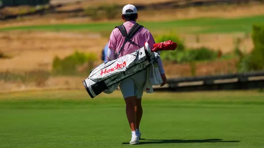 Hsuan-Yi Chen walks with his bag