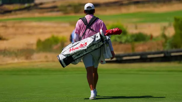 Hsuan-Yi Chen walks with his bag