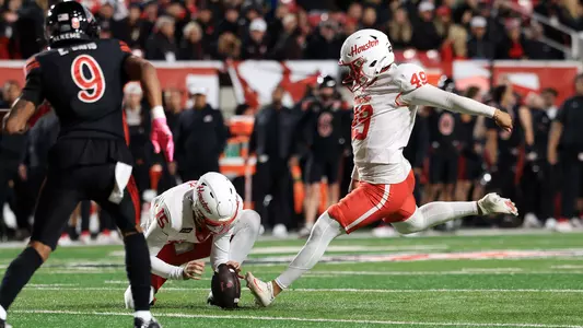 Jonathan Dimas kicking field goal
