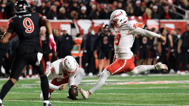 Jonathan Dimas kicking field goal