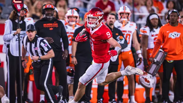 Patrick Overmyer runs with ball vs. Oklahoma State