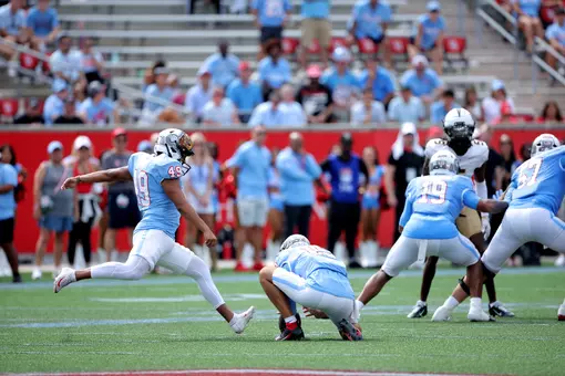 Jonathan Dimas kicking field goal
