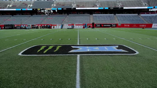 Monster x Big 12 logo on field in Houston Blue color