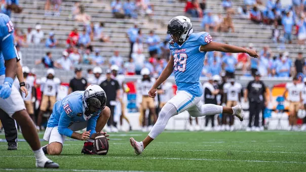 Jonathan Dimas kicking a field goal
