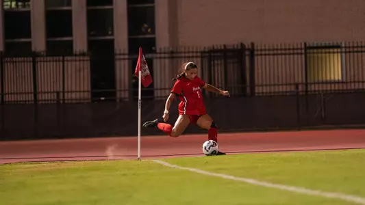 Ava Shannon kicking a corner kick