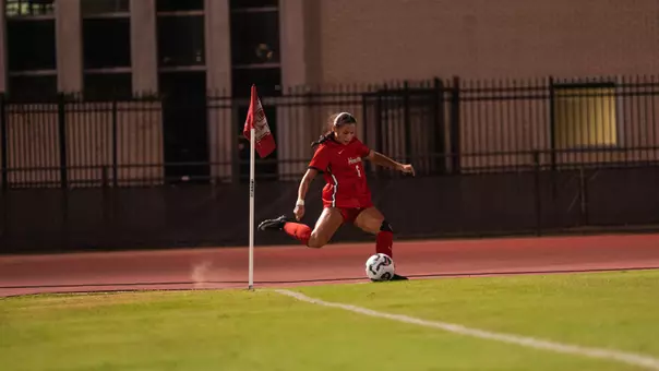 Ava Shannon kicking a corner kick