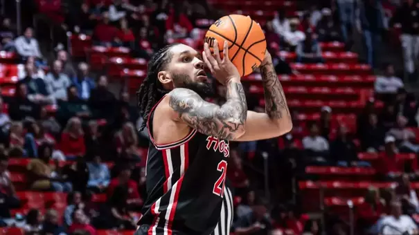 Emanuel Sharp shooting a basketball