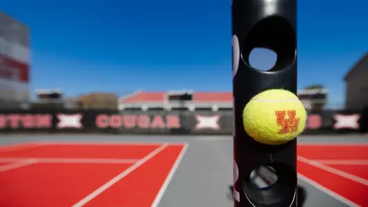 Tennis Ball in score tower with courts in background