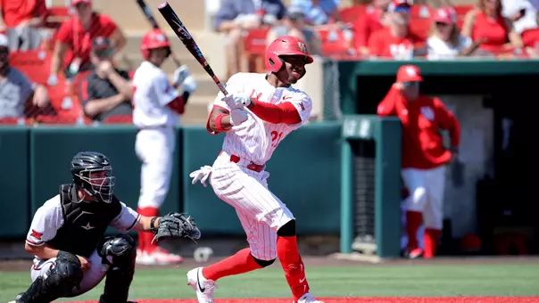 Tre Broussard follows through a swing after hitting a pitch to the right side.