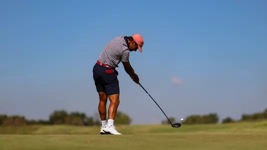 Hudson Weibel, strking the ball off the tee at near impact