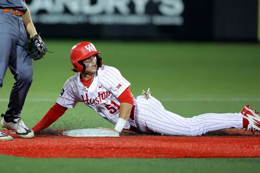 Jackson LaLima looks back after diving into second base.