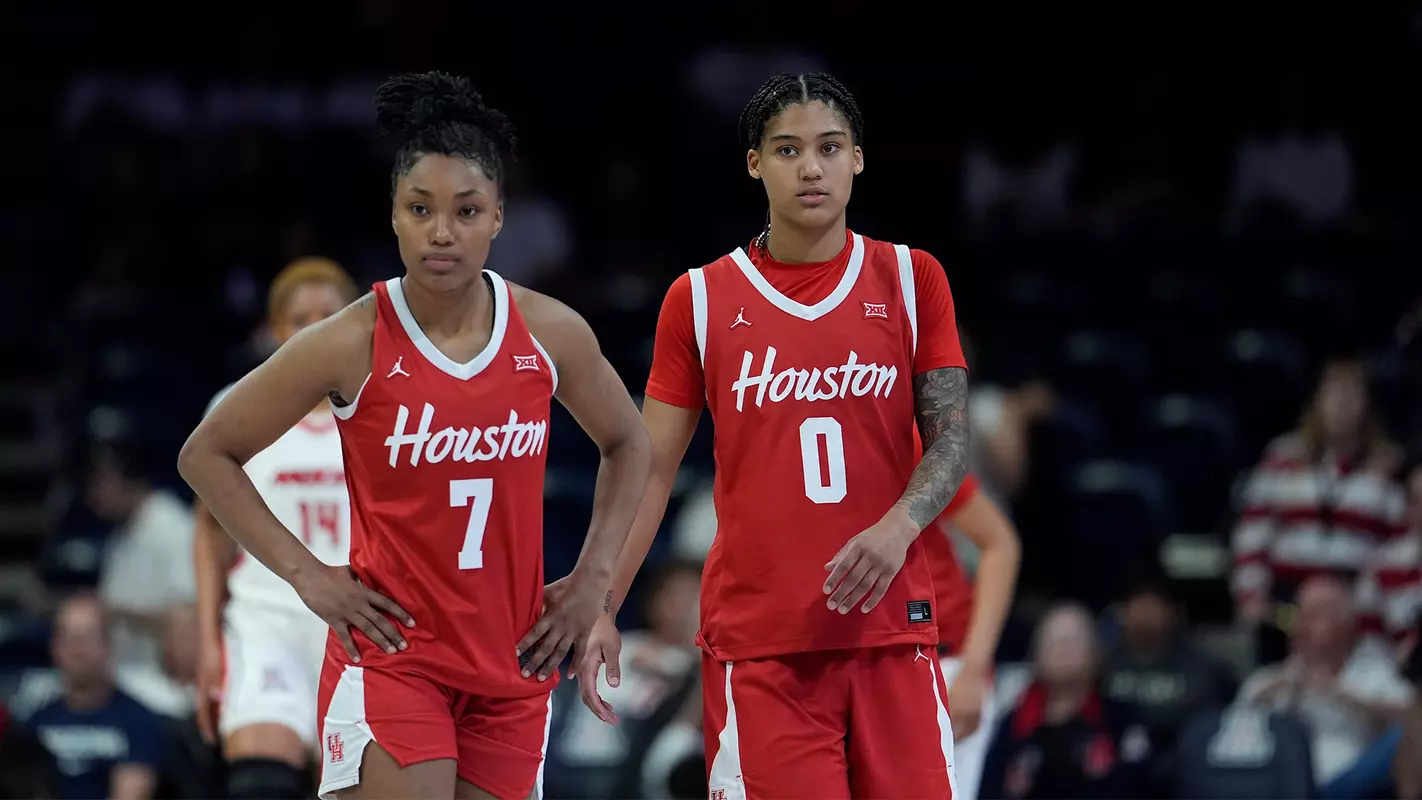 Kyndall Hunter and TK Pitts standing next to each other on the basketball court