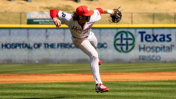Jackson LaLima makes an off-balance throw to first from third.,