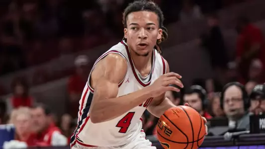 Kingston Flemings dribbles a basketball