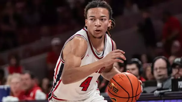 Kingston Flemings dribbles a basketball