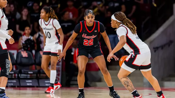 Kayla King with Cincinnati defender in front of her