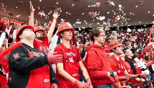 Houston students throwing newspapers in the air during pregame lineup introductions