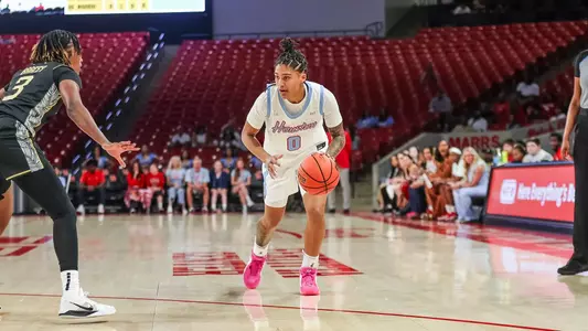 TK Pitts dribbling basketball vs. UCF defender