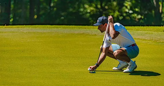 Hudson Weibel lining up his putt on green at Argent Financial Classic